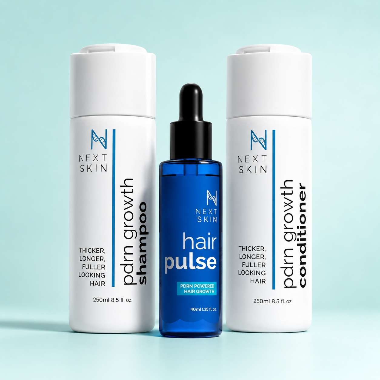 Next Skin complete hair routine featuring PDRN Growth shampoo, Hair Pulse serum and PDRN Growth conditioner on a light blue background