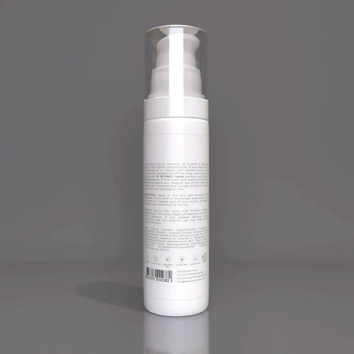 a bottle of retinol cream sitting on a table.