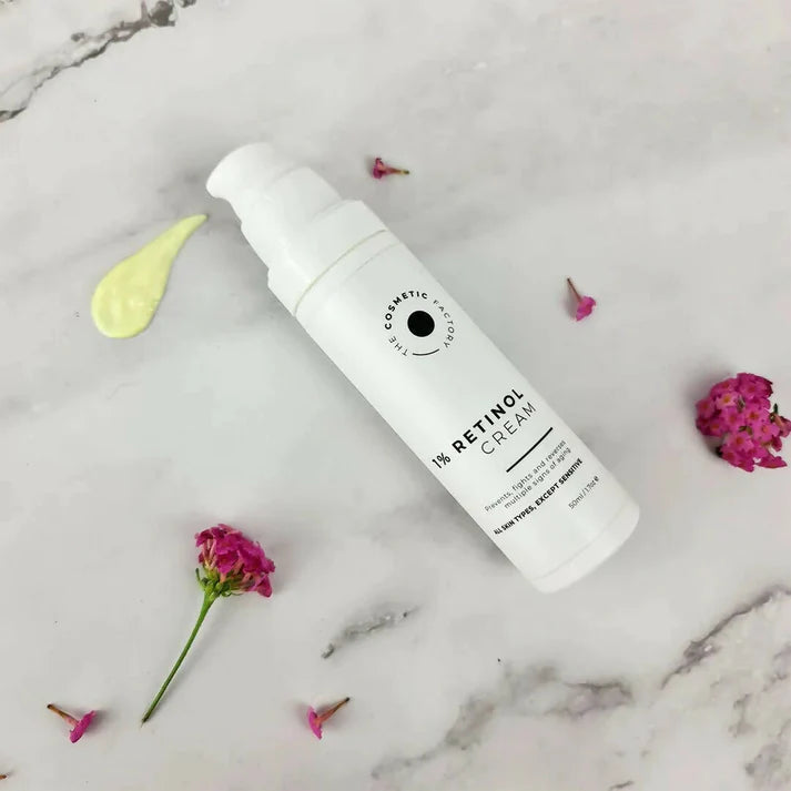 a bottle of retinol cream sitting on a table.