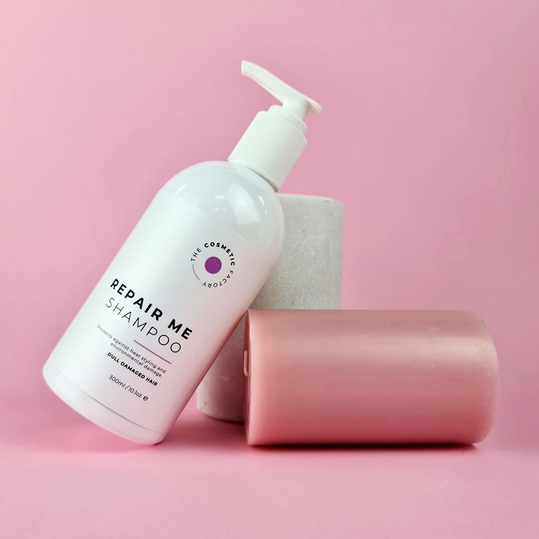 a bottle of repair me shampoo 300ml on a purple background.