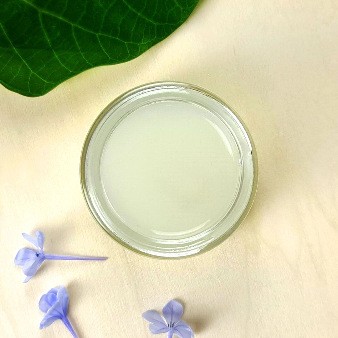 a jar of 10% glycolic acid mask 50ml on a grey surface.