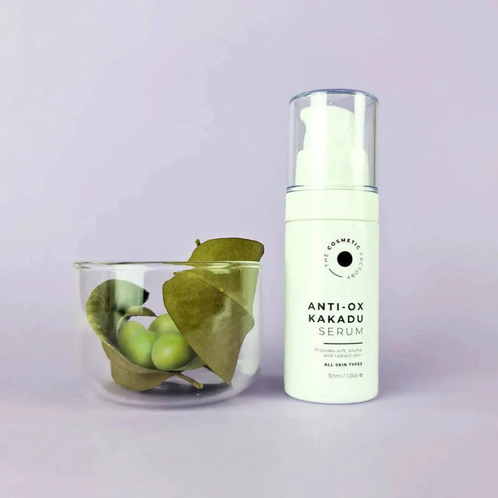 a bottle of anti-ox kakadu serum 30ml on a table next to a glass bowl.
