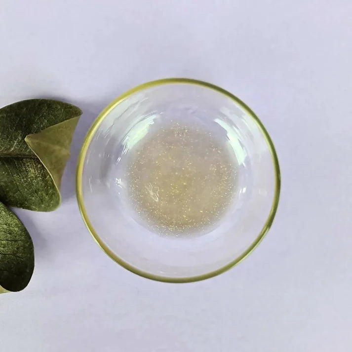 a glass bowl of anti-ox kakadu serum 30ml on a table.