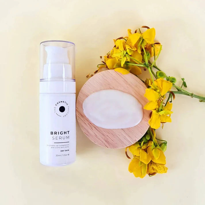 a bottle of bright serum 30ml sitting on a table.
