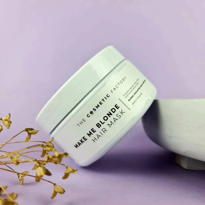 a jar of make me blonde hair mask 250ml on a purple background  with flowers.
