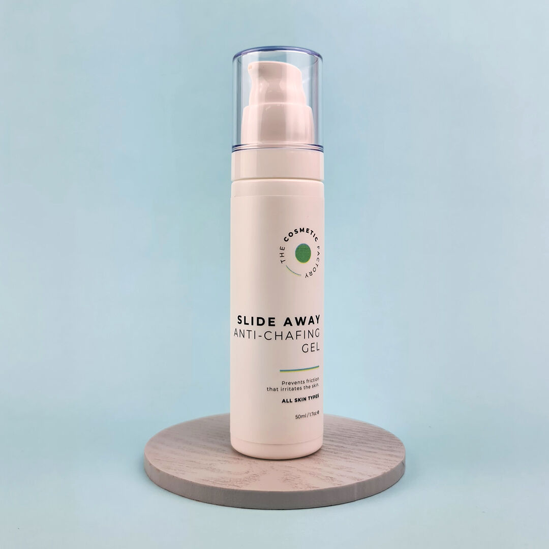 a bottle of slide away anti-chafing gel 50ml sitting on a green surface.